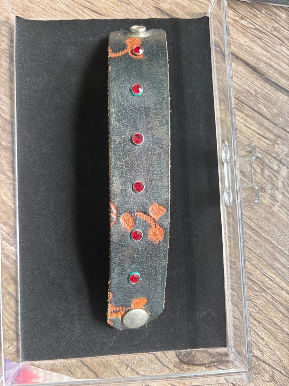 Black Leather Wrist Cuff with Orange Embroidery and Red Studs